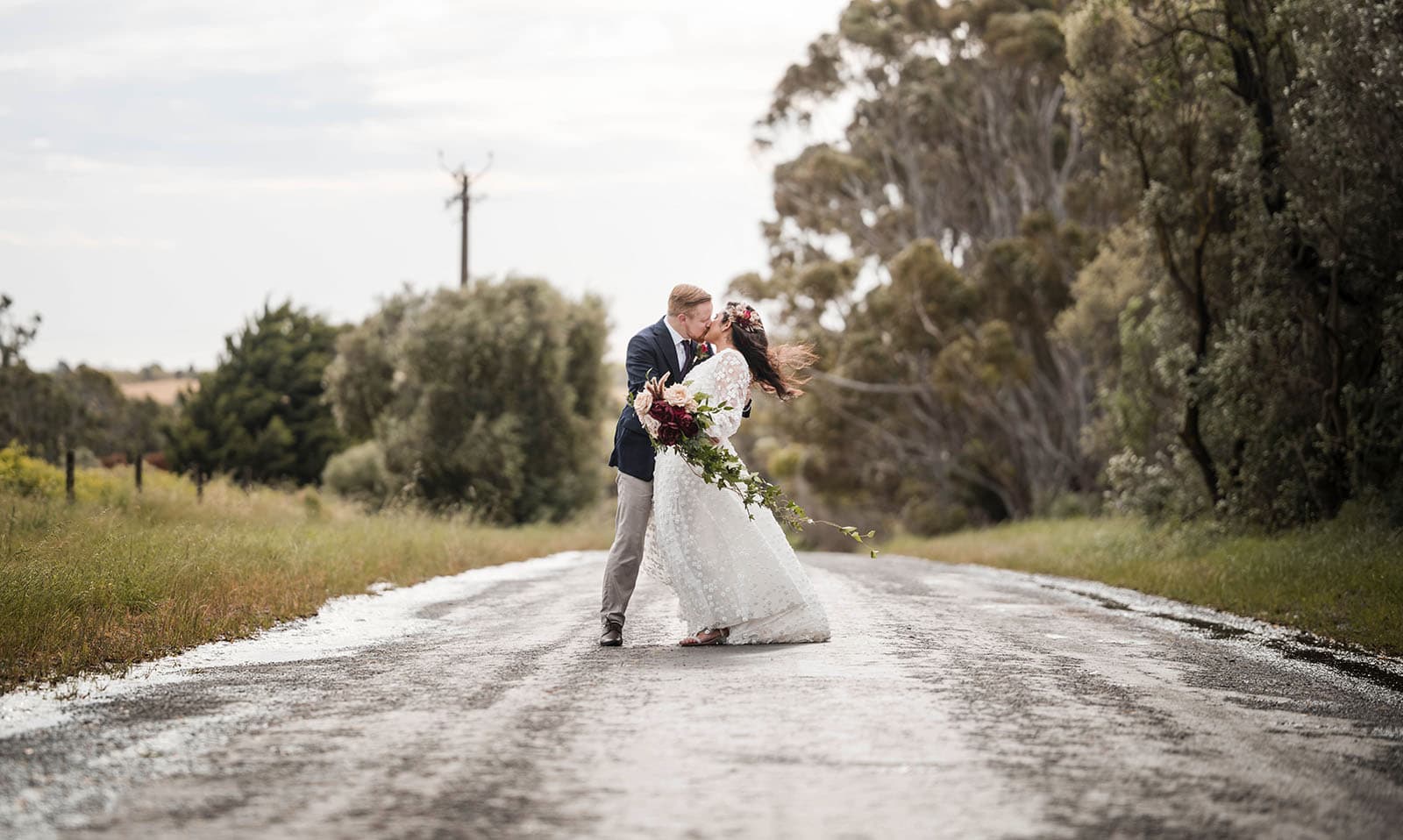ekhidna winery wedding - chami & bryce 37 Bridal couple on wet road