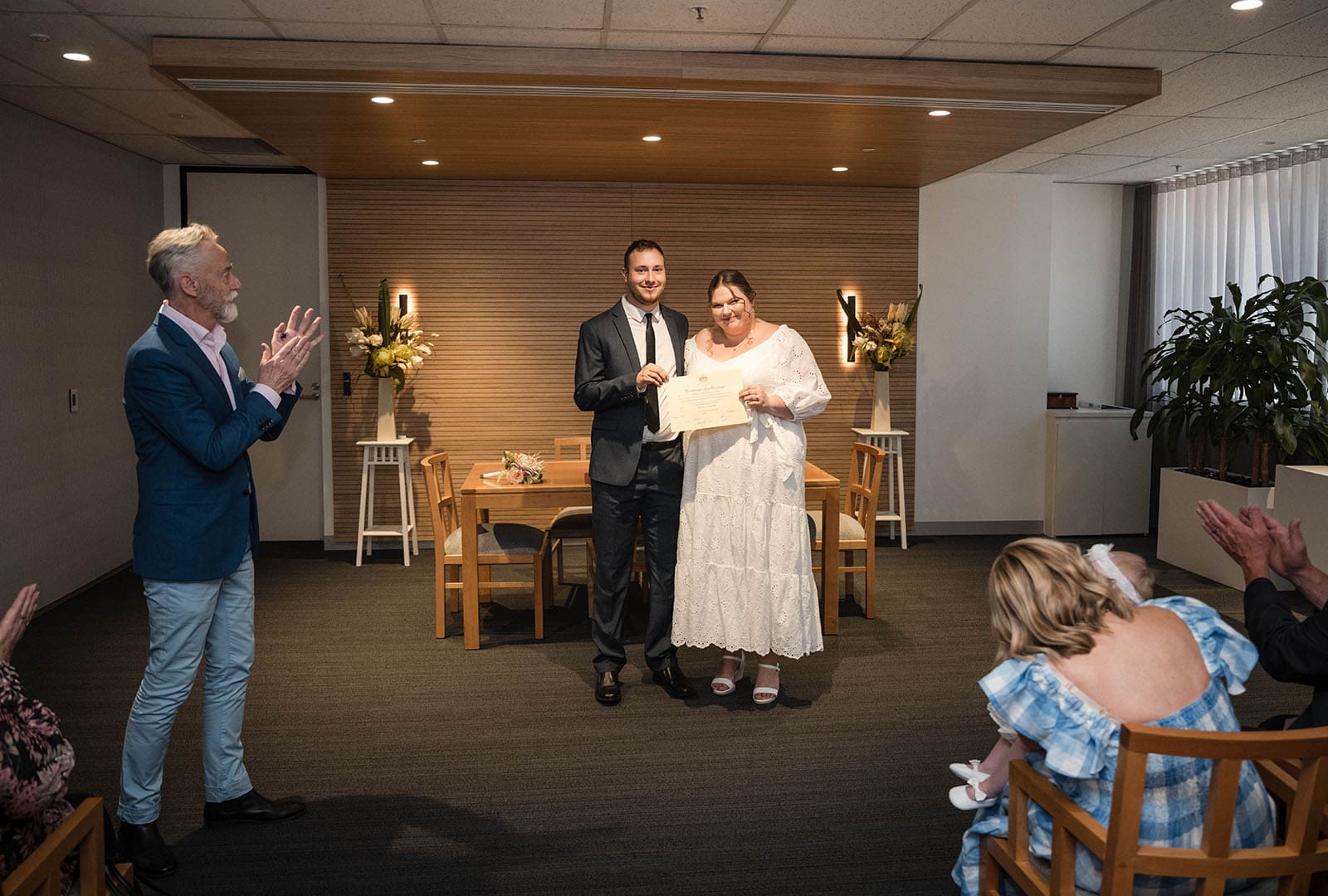 marriages registration office wedding - dayna & alex 9 Bride and groom holding marriage certificate