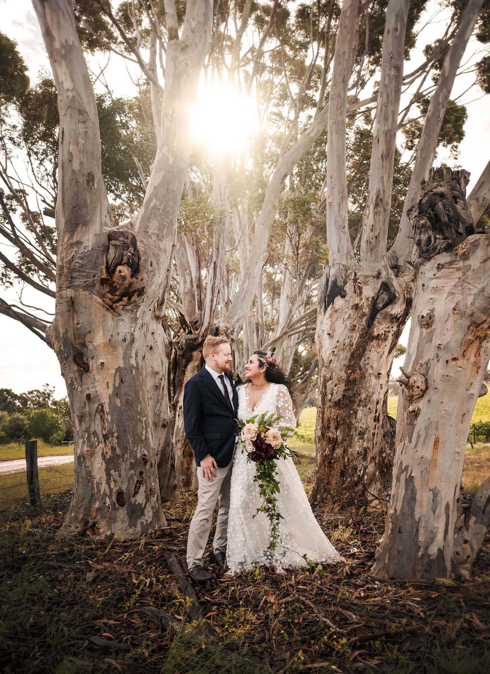 ekhidna winery wedding - chami & bryce 44 Bride and groom in gum tree lane and sun