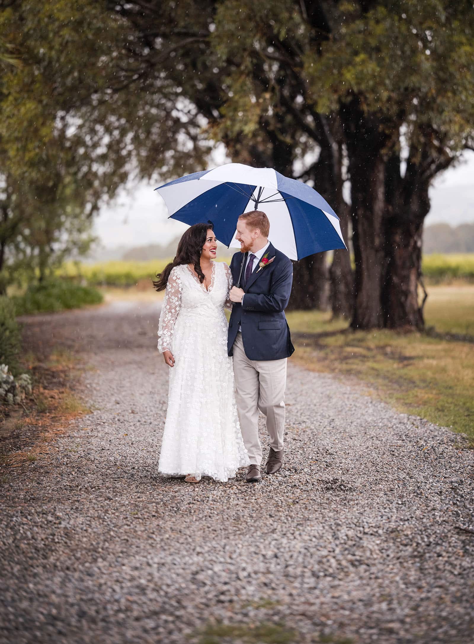 ekhidna winery wedding - chami & bryce 20 Bride and groom under umbrella