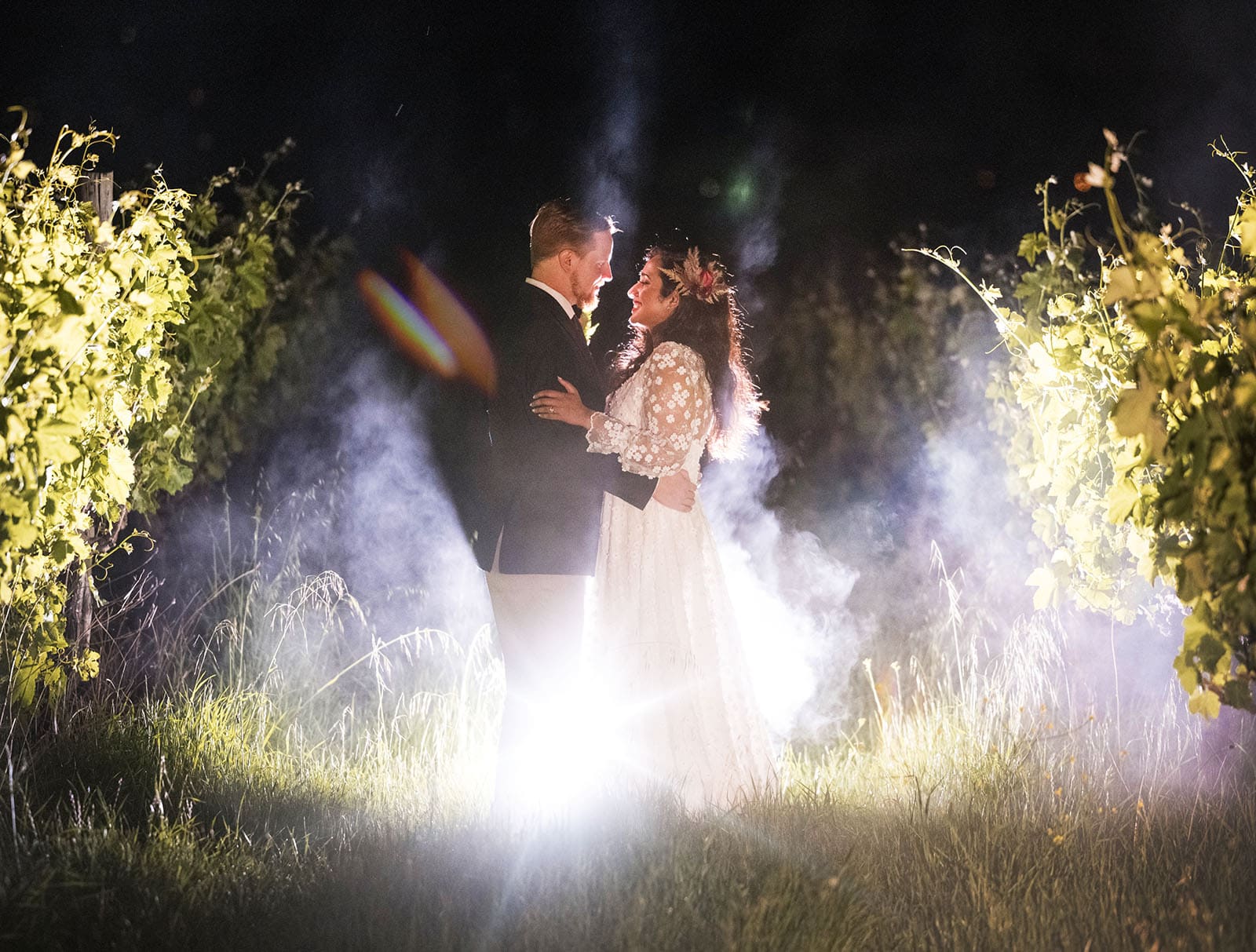 ekhidna winery wedding - chami & bryce 52 Bride and groom with smoke in vines