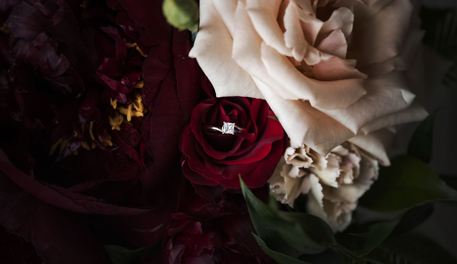 ekhidna winery wedding - chami & bryce 2 Engagement ring in red rose in bouquet