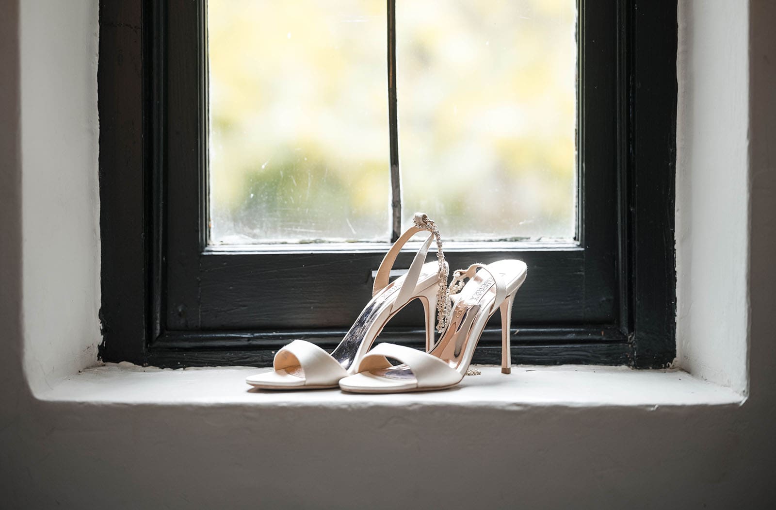 the manor basket range wedding - cassie & danny 15 Bridal shoes on window sill