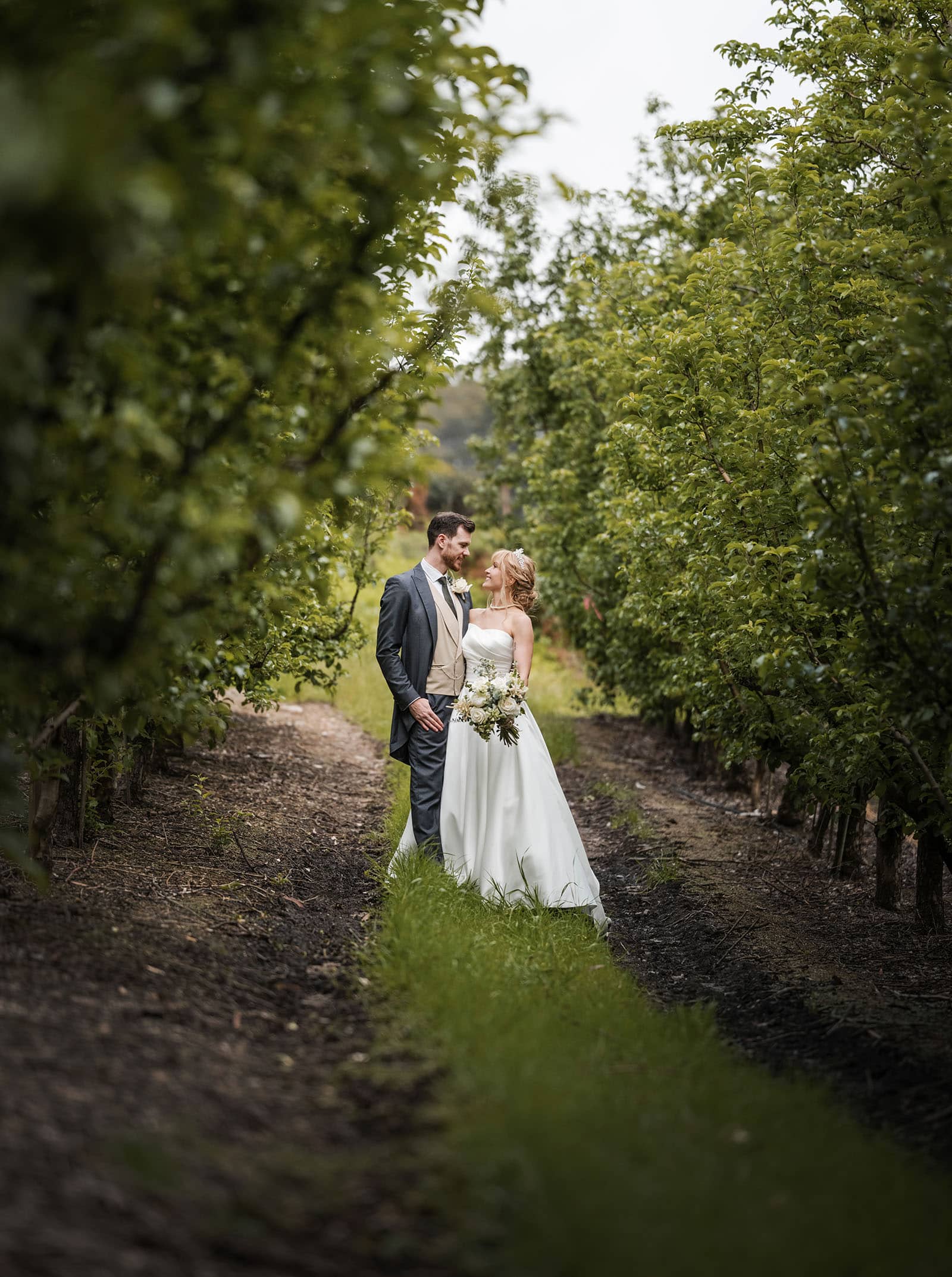 the manor basket range wedding - cassie & danny 57 Bride and groom in orchard