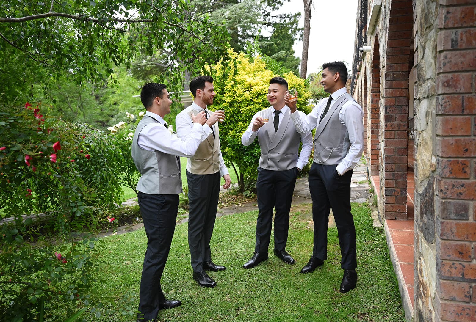 the manor basket range wedding - cassie & danny 7 Groomsmen standing on grass