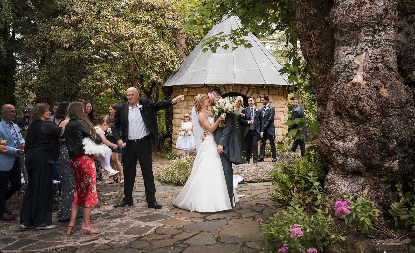the manor basket range wedding - cassie & danny 40 Kiss in front of little chapel