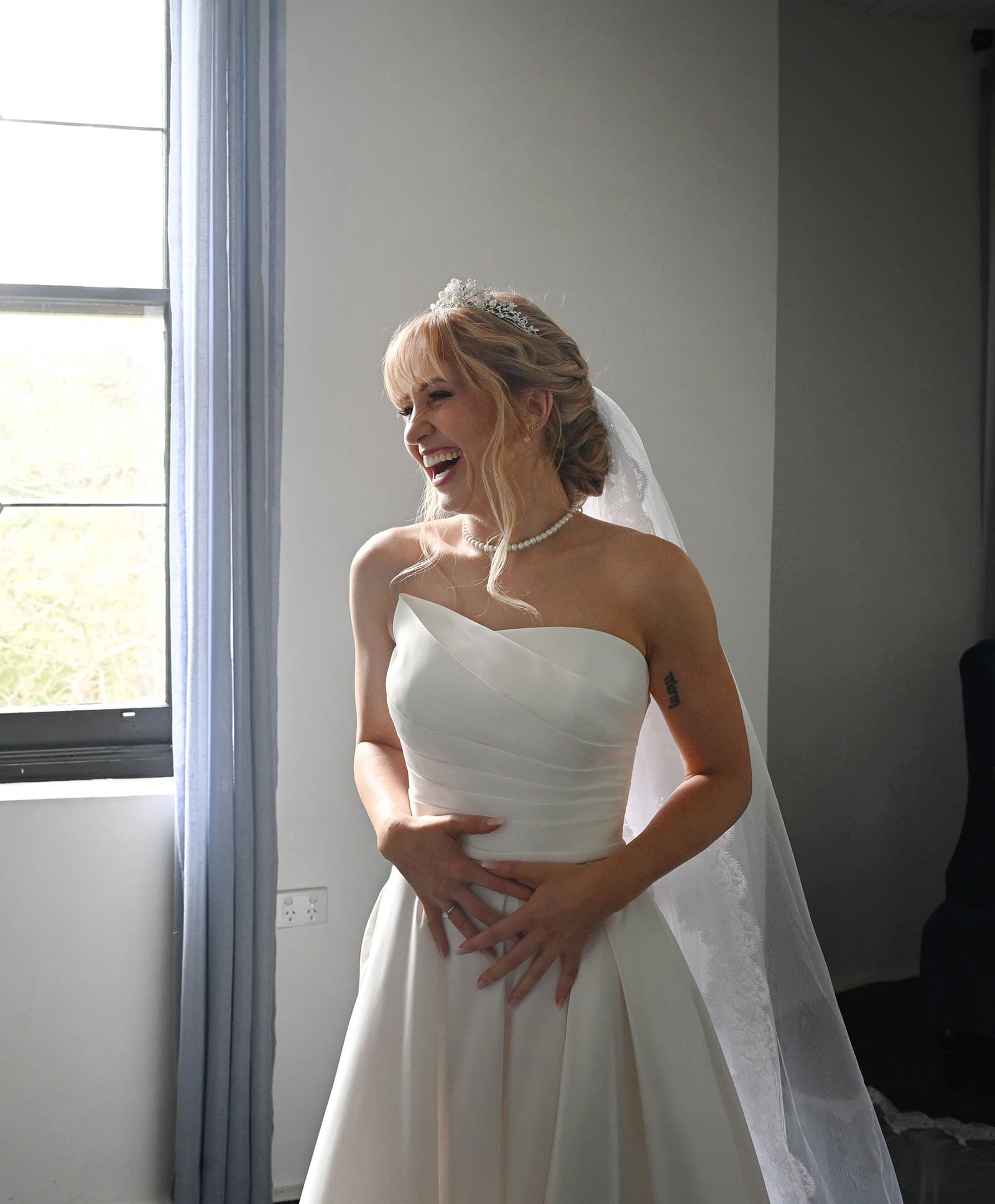 the manor basket range wedding - cassie & danny 25 Laughing bride during preparation