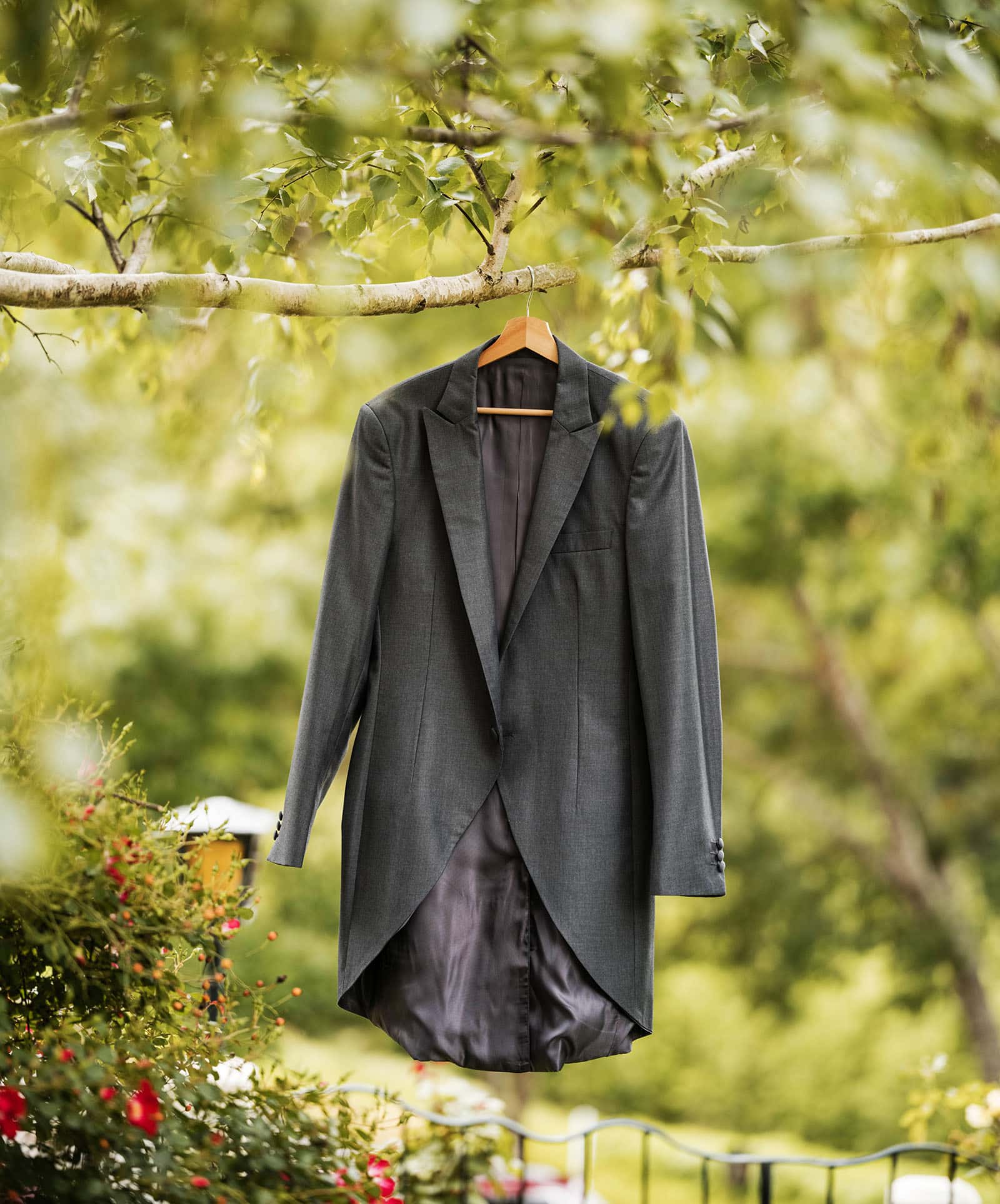 the manor basket range wedding - cassie & danny 3 Suit jacket hanging in tree