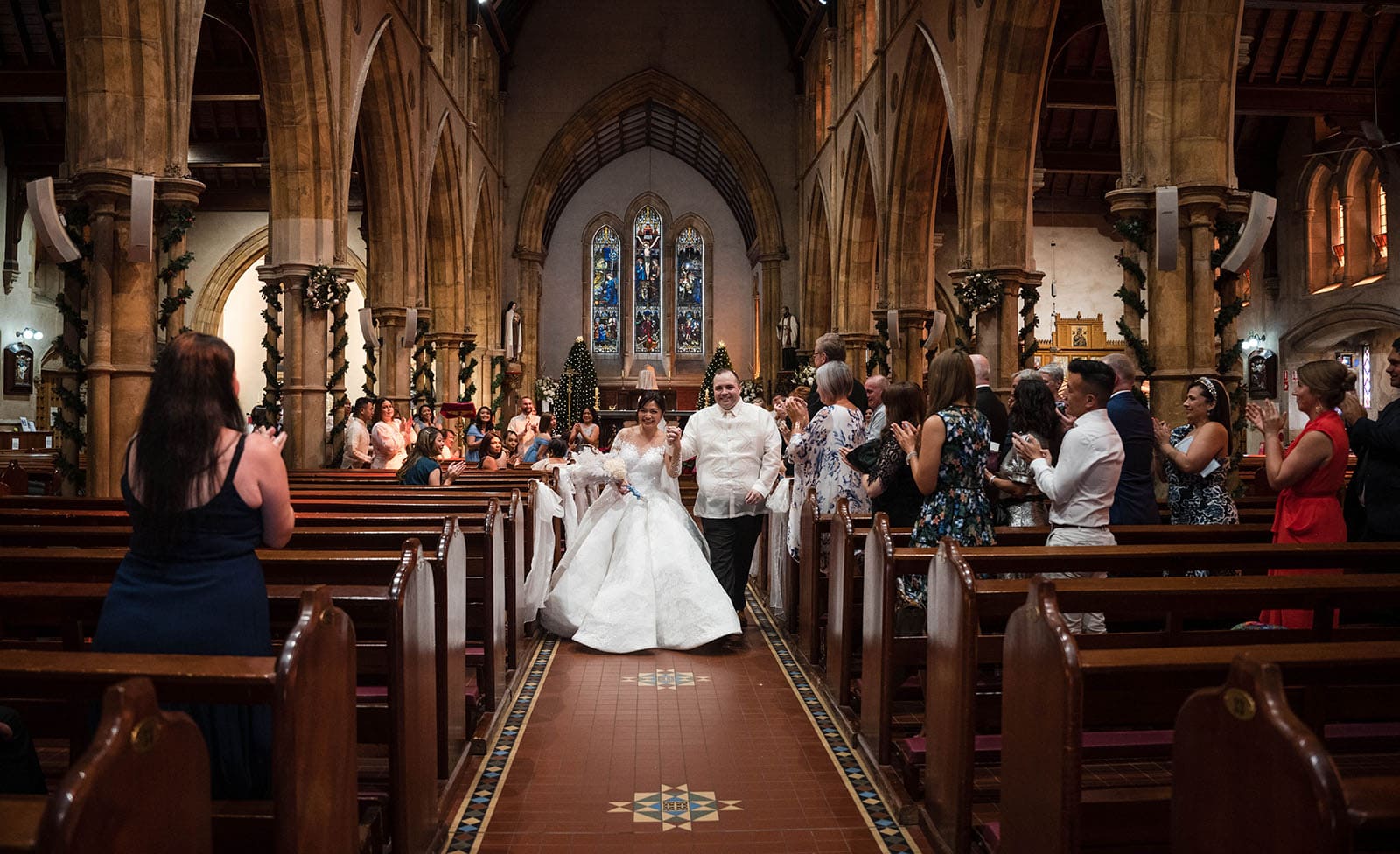 st francis xaviers cathedral wedding - sash & dan 35 Bride and groom exit cathedral