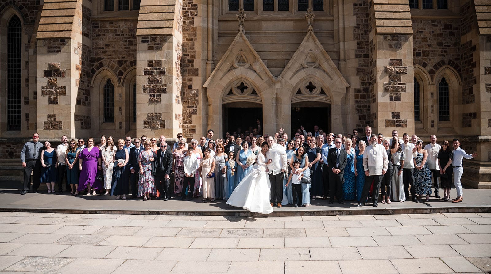 st francis xaviers cathedral wedding - sash & dan 36 Group photo in front of cathedral