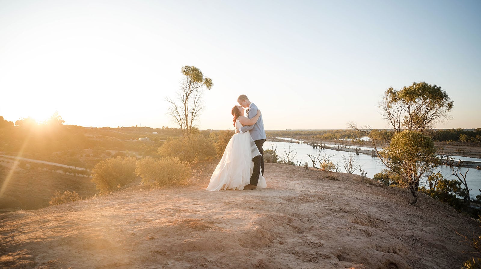 riverland wine centre wedding - lisa & mitch 206 Bridal couple under dying sunlight