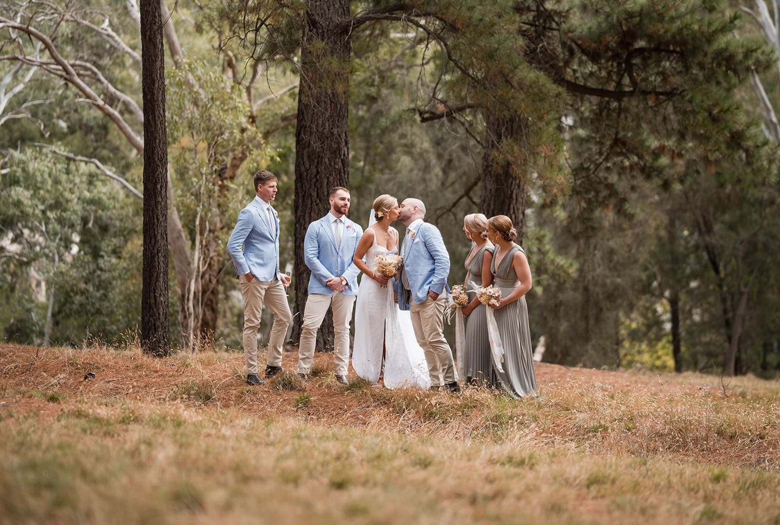 house on haines wedding - danieka & jack 48 bride an dgroom kissing in group shot