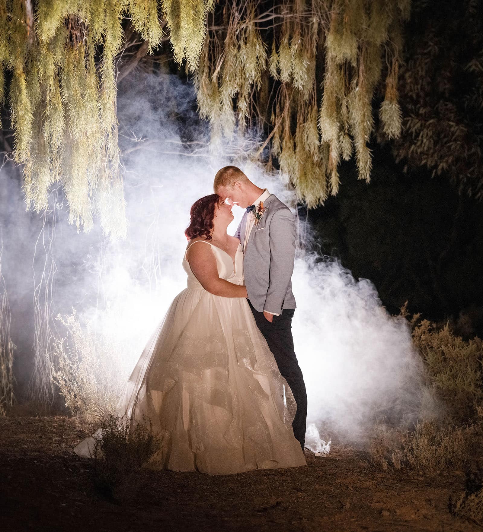 riverland wine centre wedding - lisa & mitch 209 Bride and groom backed by smoke