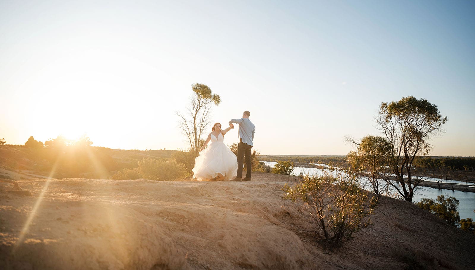 riverland wine centre wedding - lisa & mitch 204 Bride and groom dancing under sunset