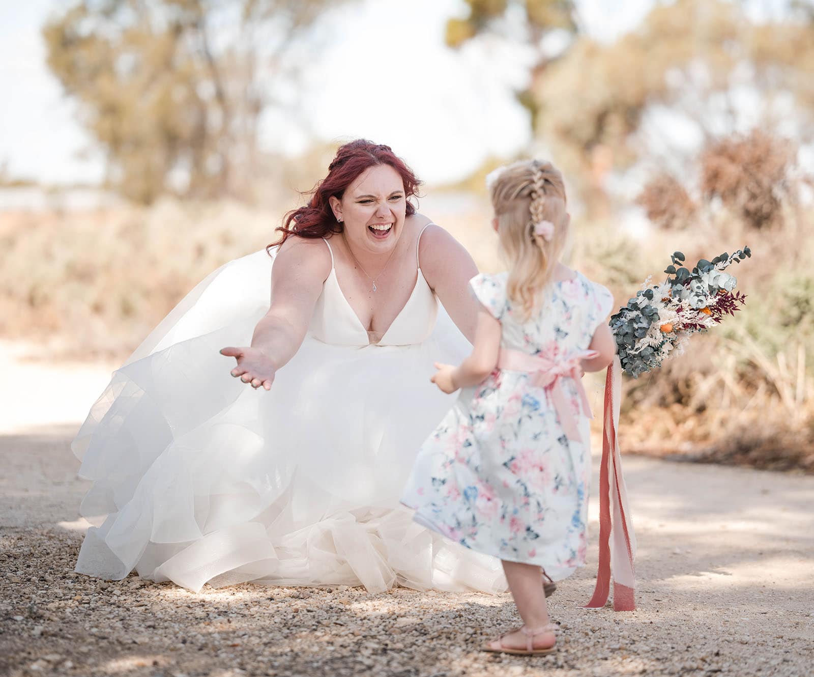 riverland wine centre wedding - lisa & mitch 212 bride greeting little girl