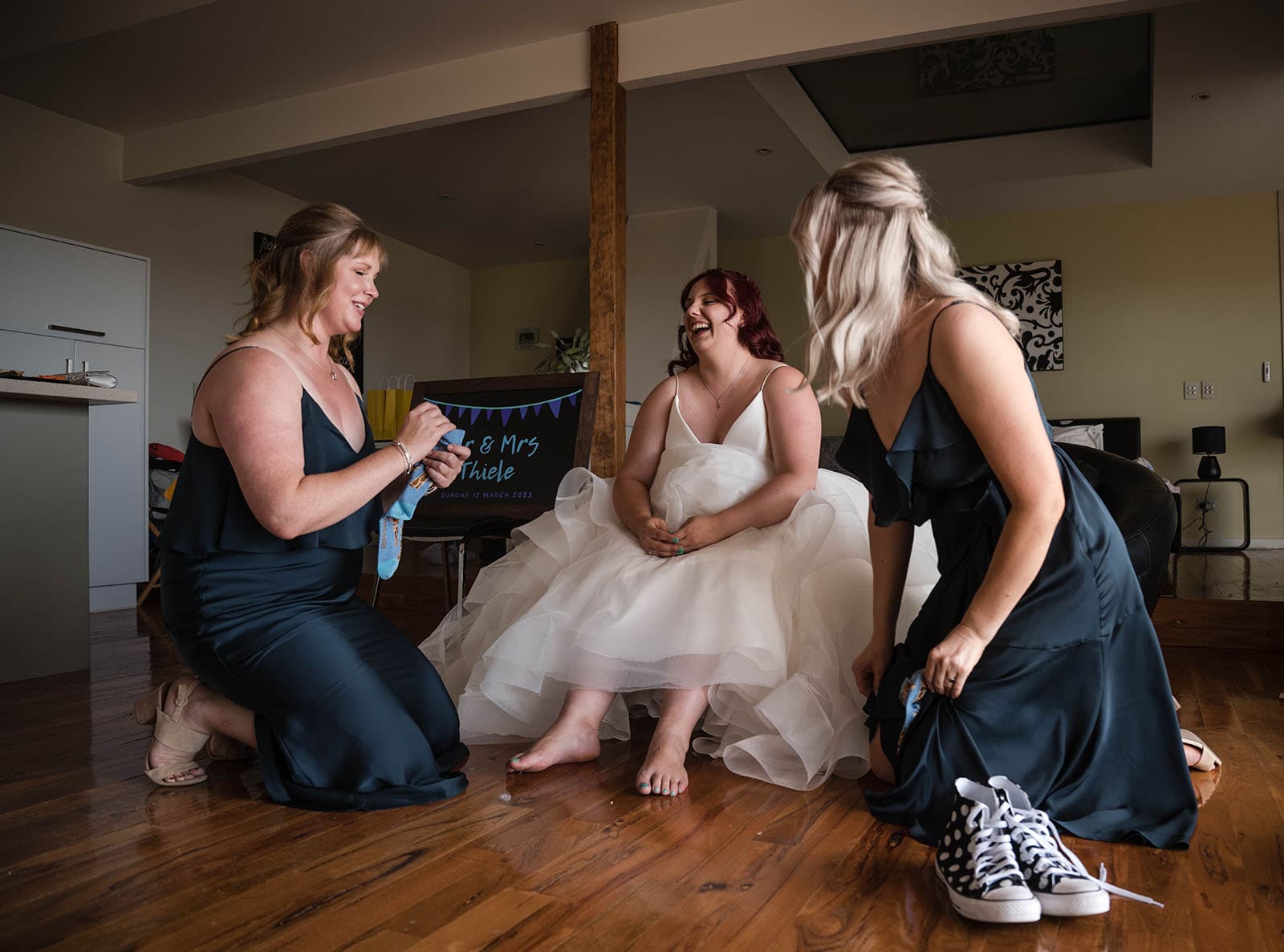 riverland wine centre wedding - lisa & mitch 174 Bride having socks put on