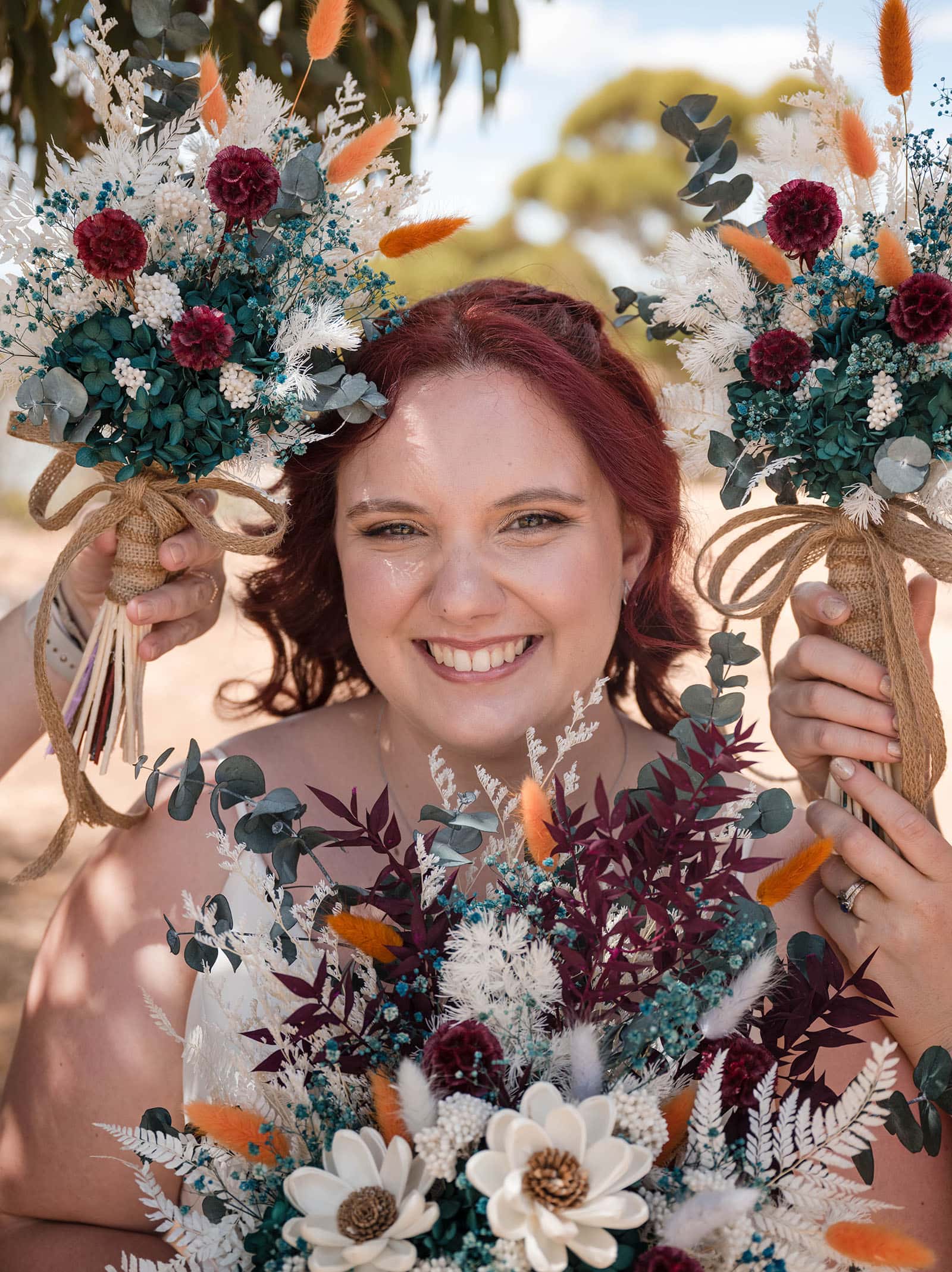 riverland wine centre wedding - lisa & mitch 179 Bride smiling surrounded by flowers