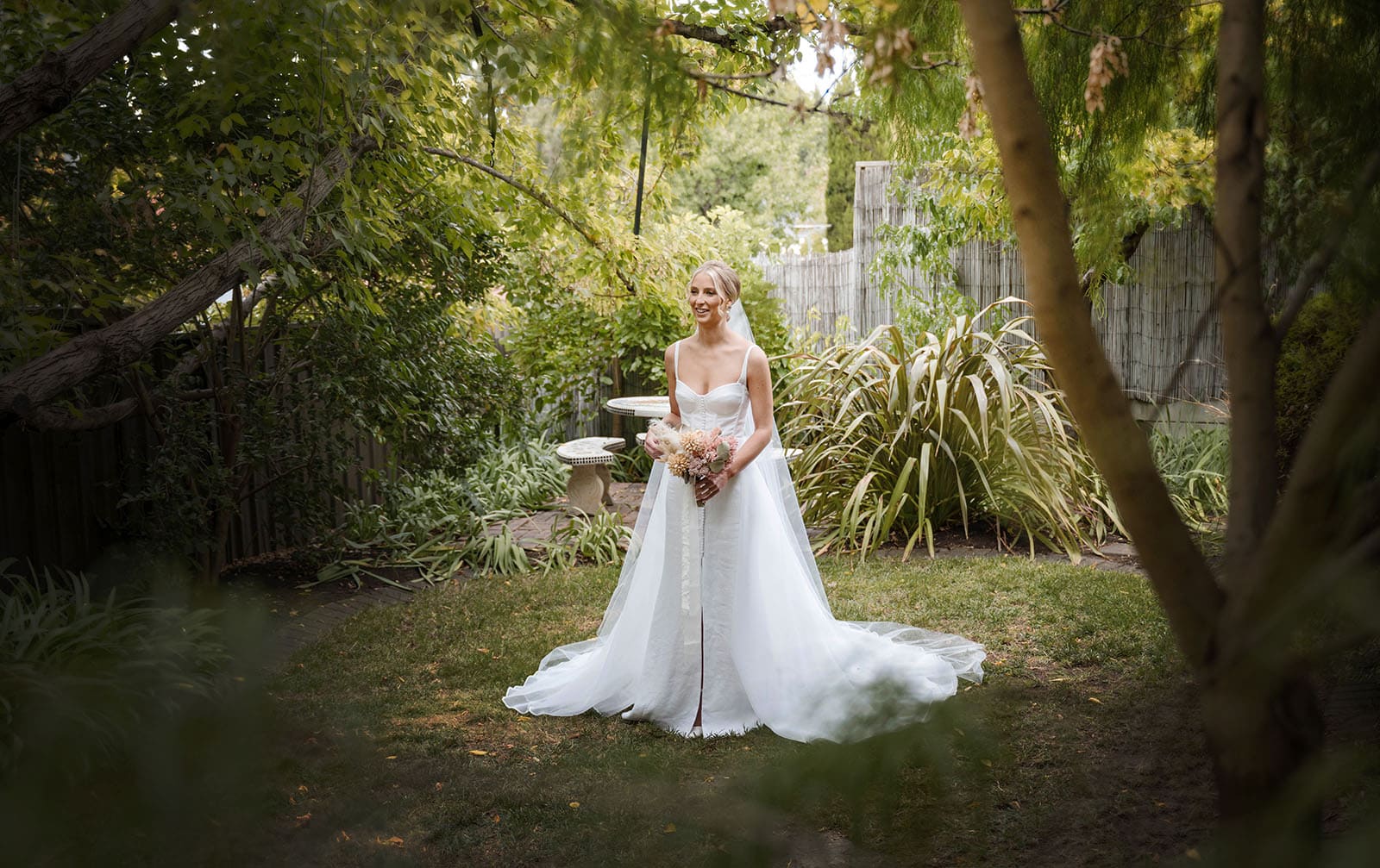 house on haines wedding - danieka & jack 35 Bride standing alone in garden