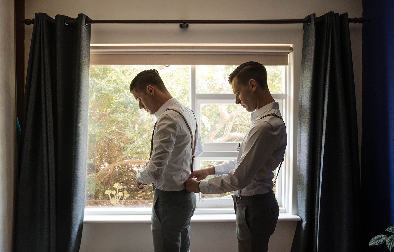 k1 winery wedding - mitch & nick 87 Grooms helping belt up