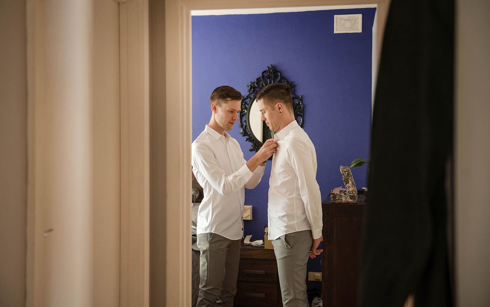 k1 winery wedding - mitch & nick 85 Grooms helping button each other up