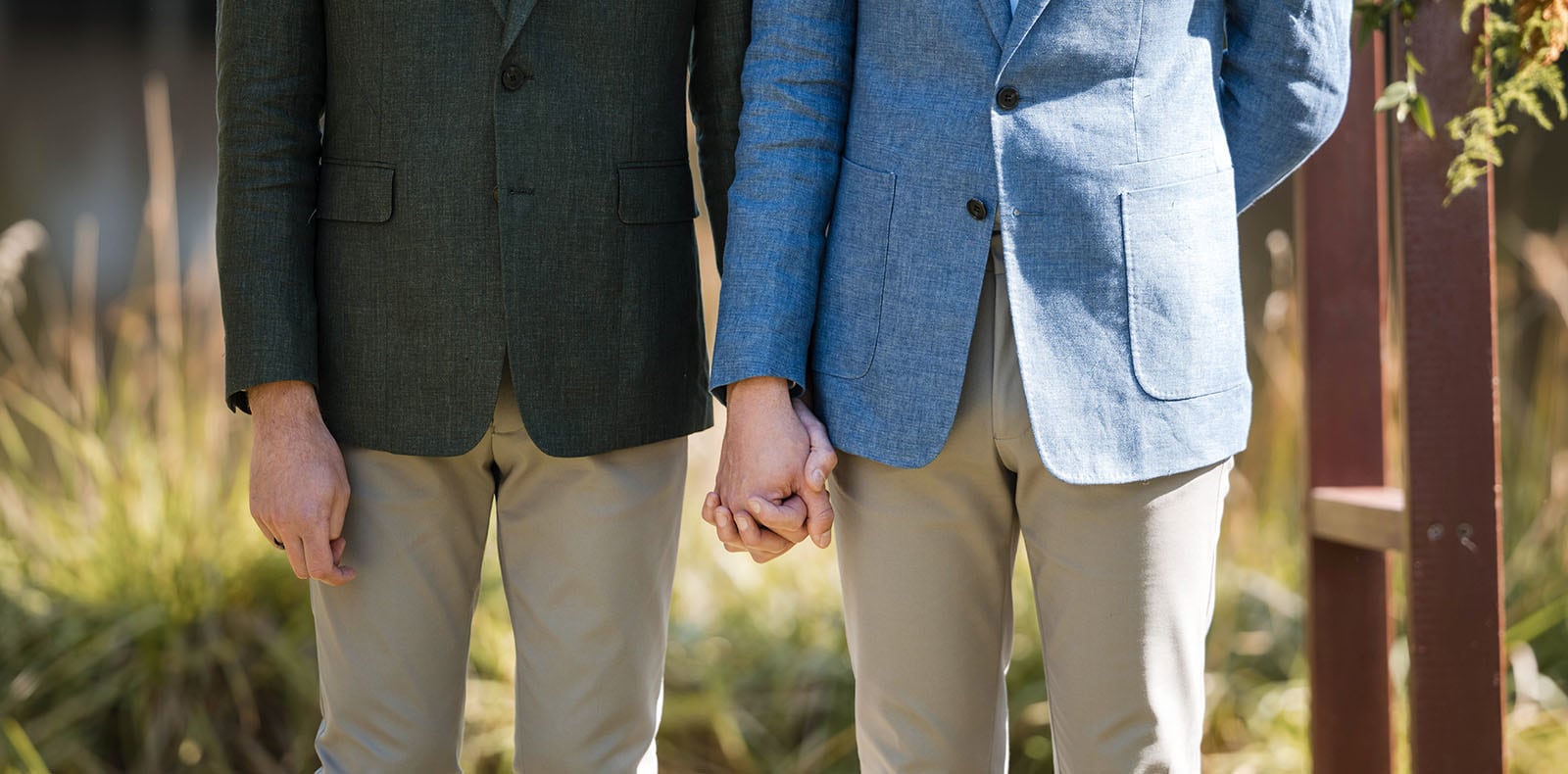k1 winery wedding - mitch & nick 110 grooms holding hands during ceremony