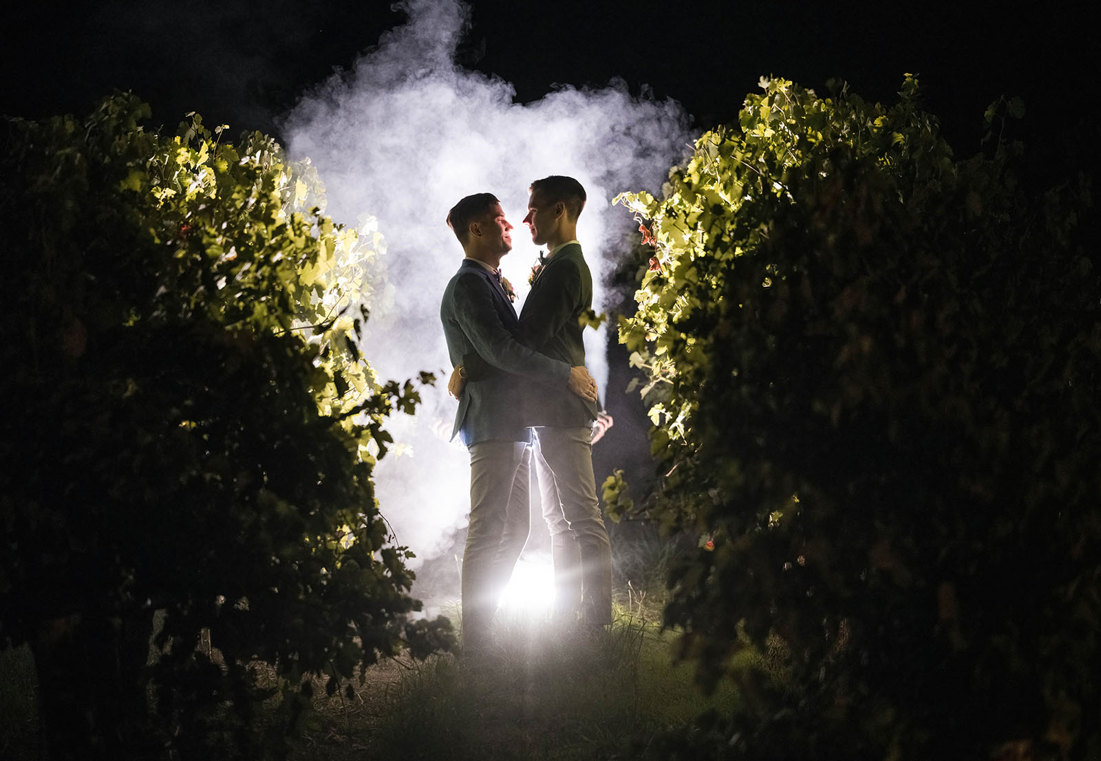 k1 winery wedding - mitch & nick 141 Grooms in light at night