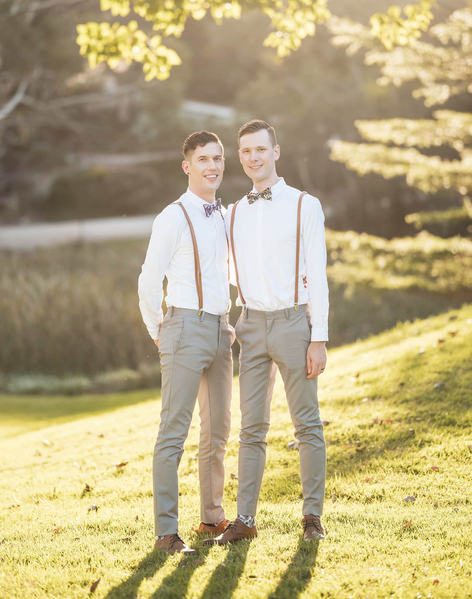 k1 winery wedding - mitch & nick 132 Grooms standing together in sunlight
