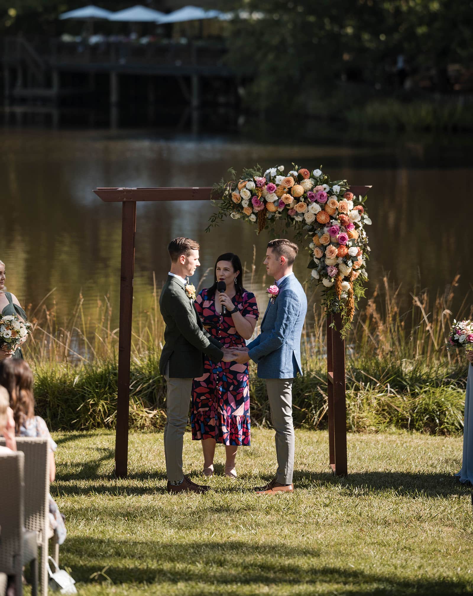 k1 winery wedding - mitch & nick 108 Grooms standing together under arbour