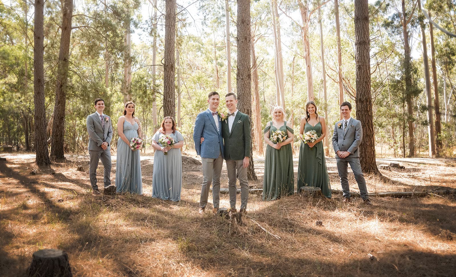 k1 winery wedding - mitch & nick 100 Grooms with wedding party in pines