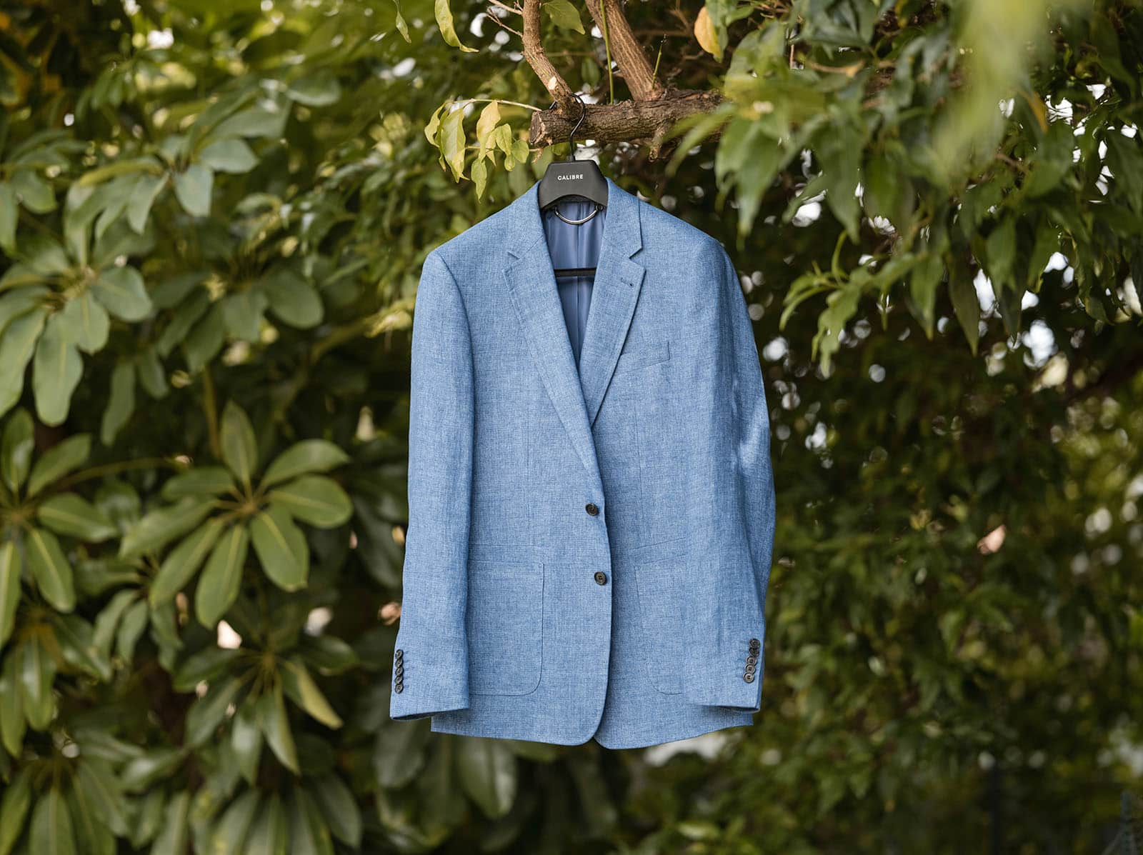 k1 winery wedding - mitch & nick 81 Jacket hanging in tree