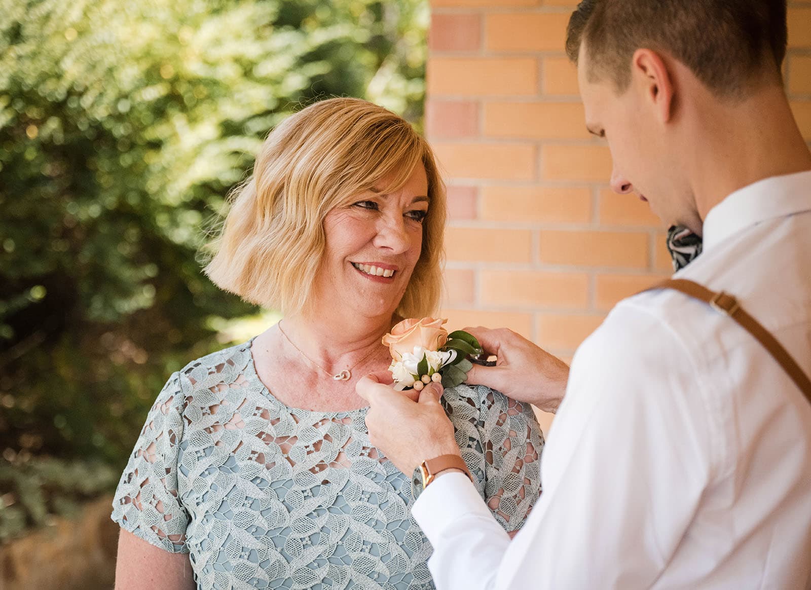 k1 winery wedding - mitch & nick 88 Mum having flower put on