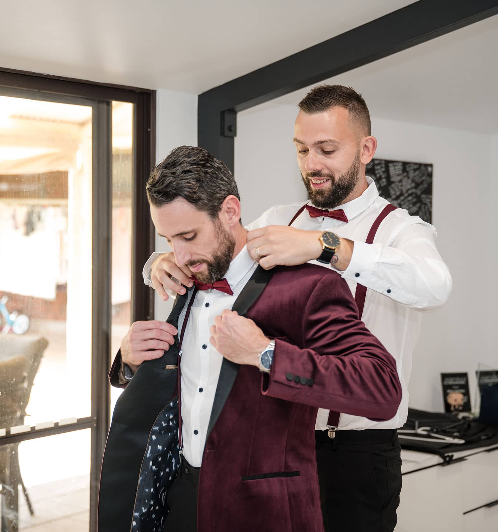 sneakys wedding - ash & michael 51 Best man placing jacket on groom