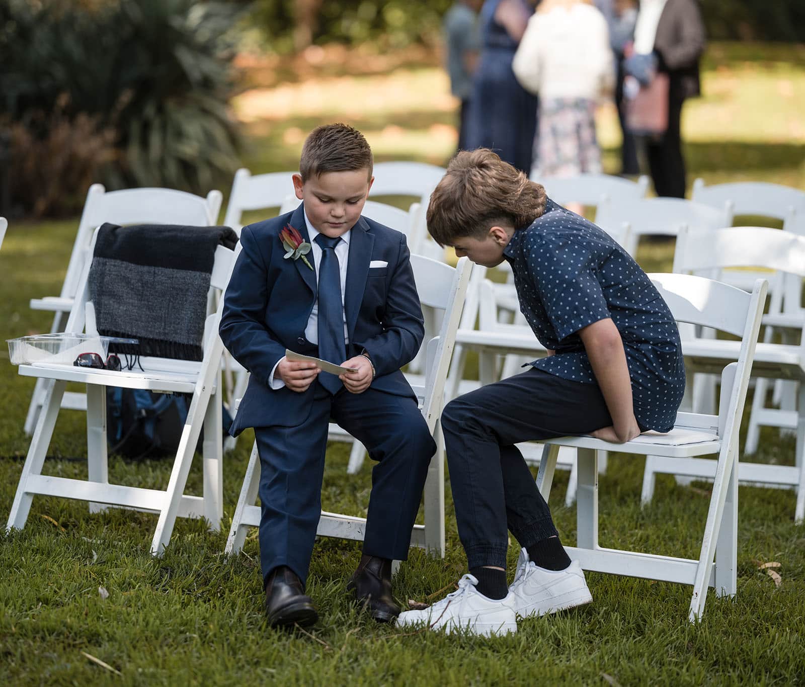 northern palm garden wedding - nicole & daryl 107 Boys going over family vows