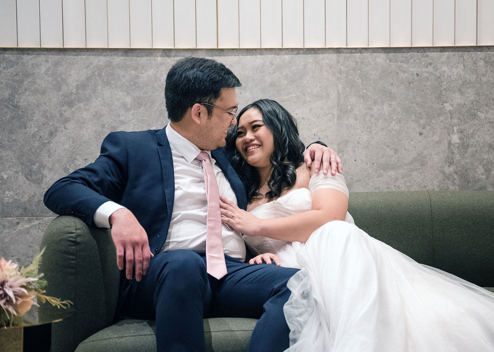 chesser st registration office wedding - khate & angelo 71 Bridal couple reclining on chair