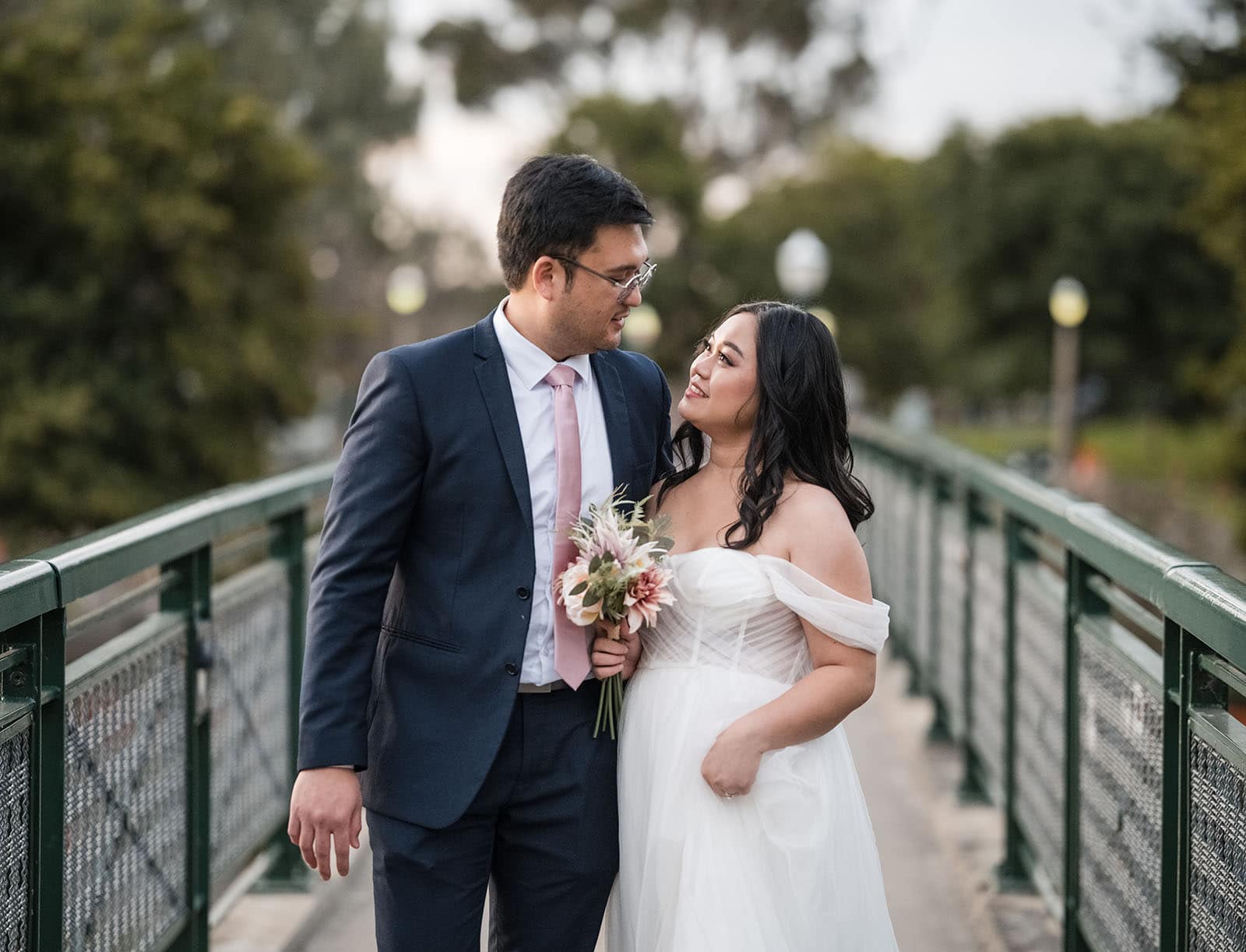 chesser st registration office wedding - khate & angelo 85 Bridal couple walking across Torrens footbridge