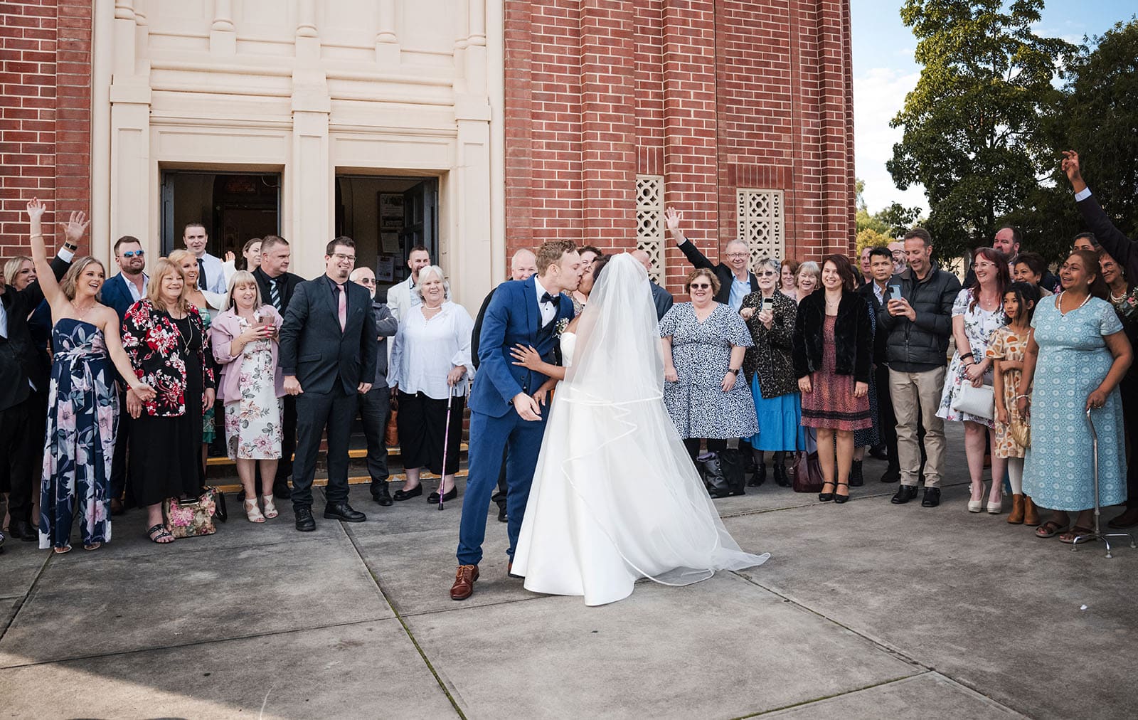 our lady of the rosary church wedding - lorraine & wayne 172 Bridal kiss in front of guests