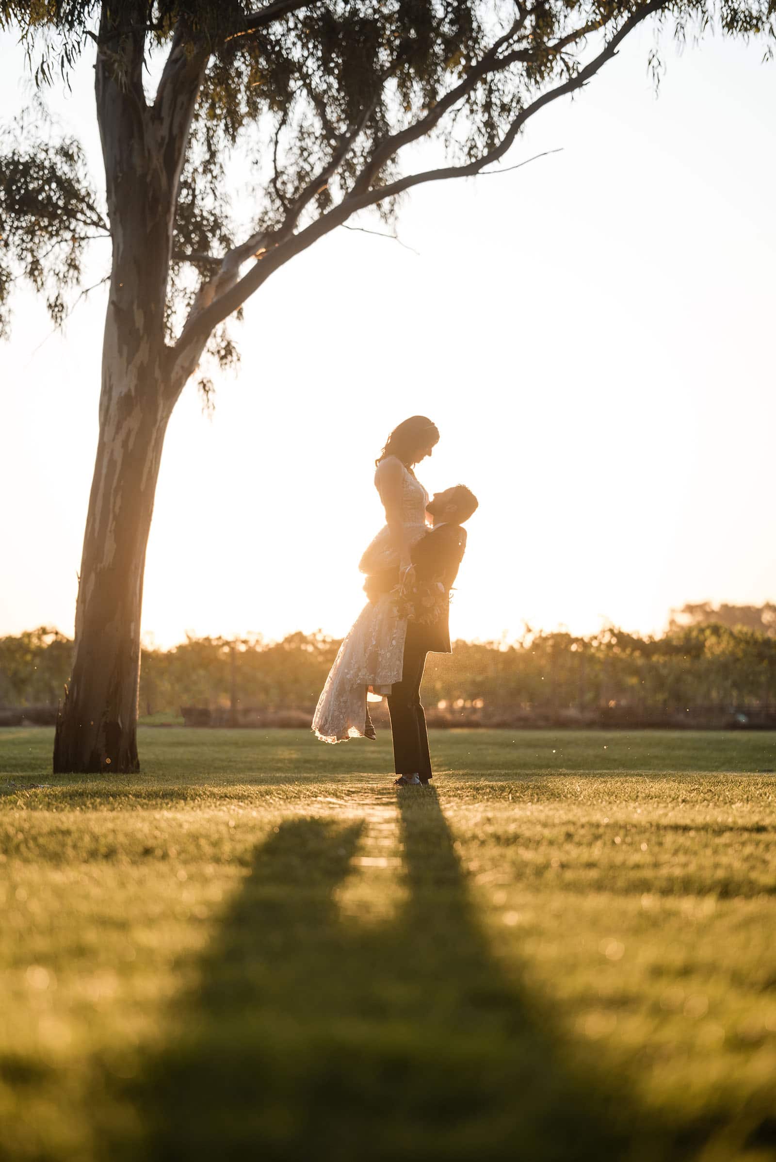 sneakys wedding - ash & michael 104 Bridal lift in sunlight