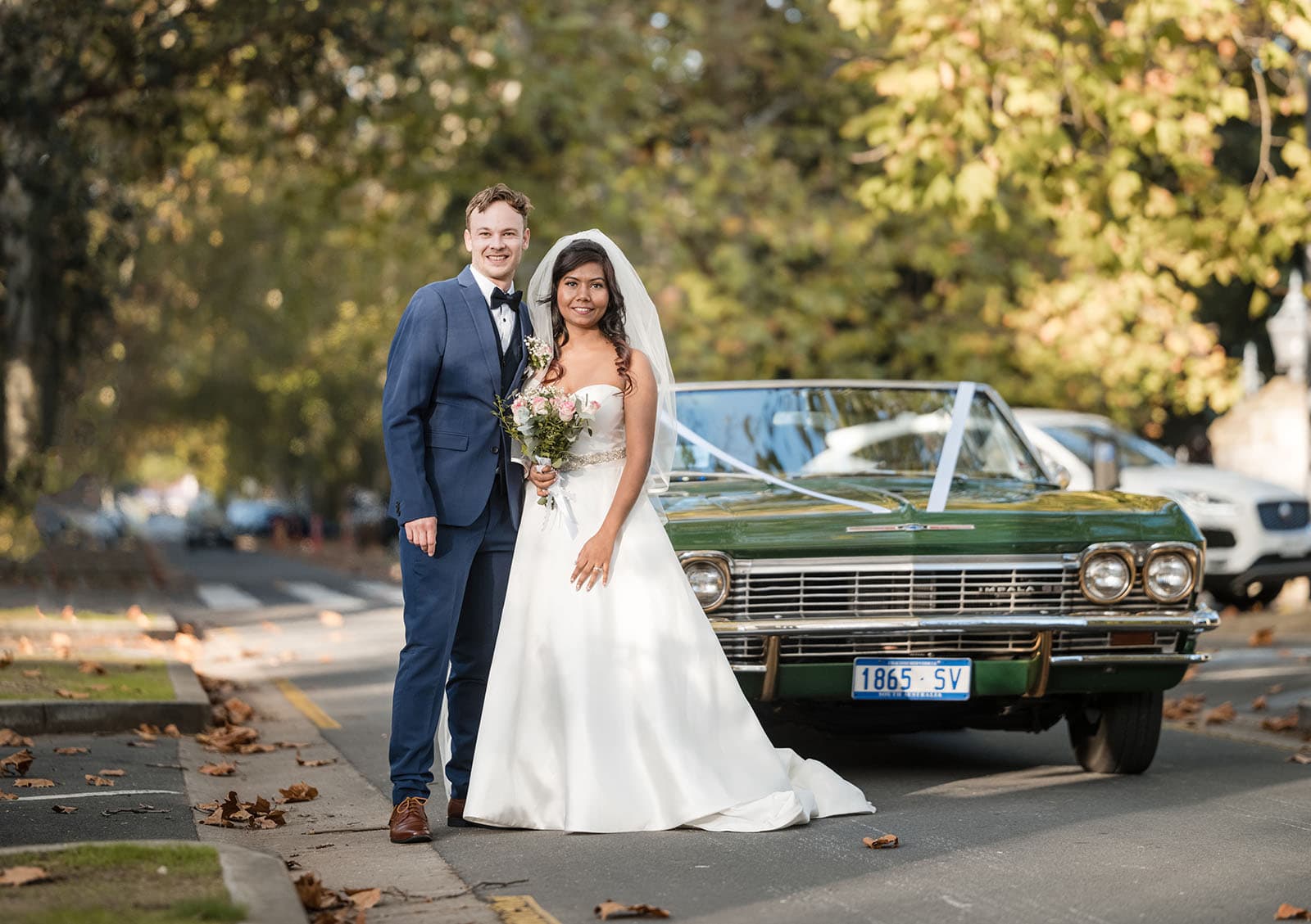 our lady of the rosary church wedding - lorraine & wayne 174 Bride and groom in front of impala