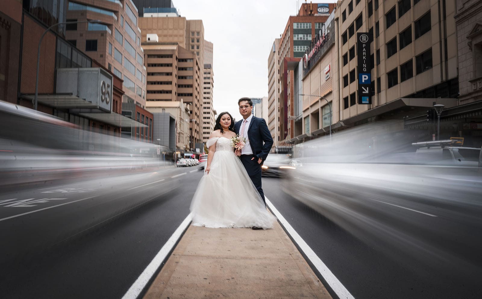 chesser st registration office wedding - khate & angelo 82 Bride and groom in middle of road