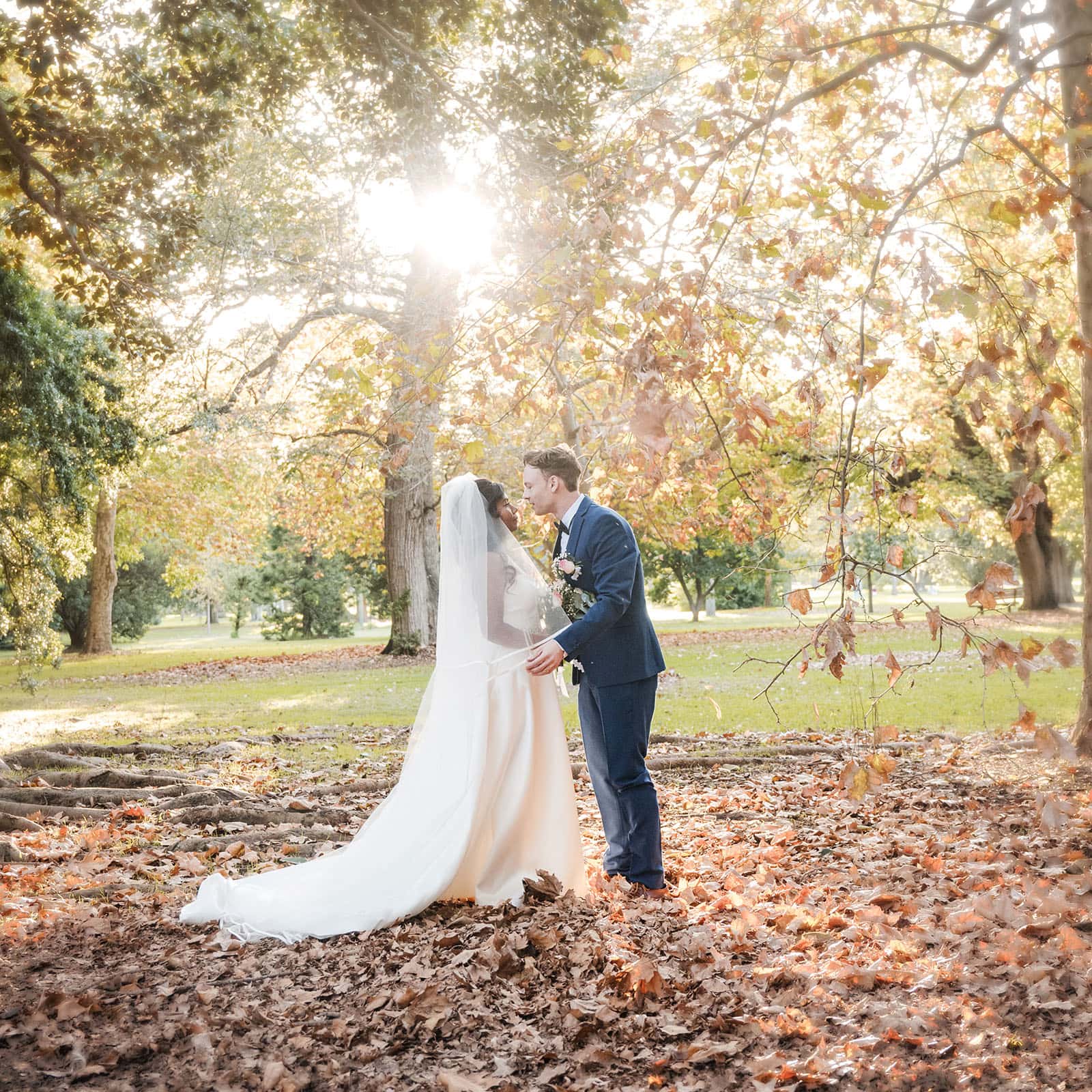our lady of the rosary church wedding - lorraine & wayne 178 Bride and groom kiss under Autumn colours