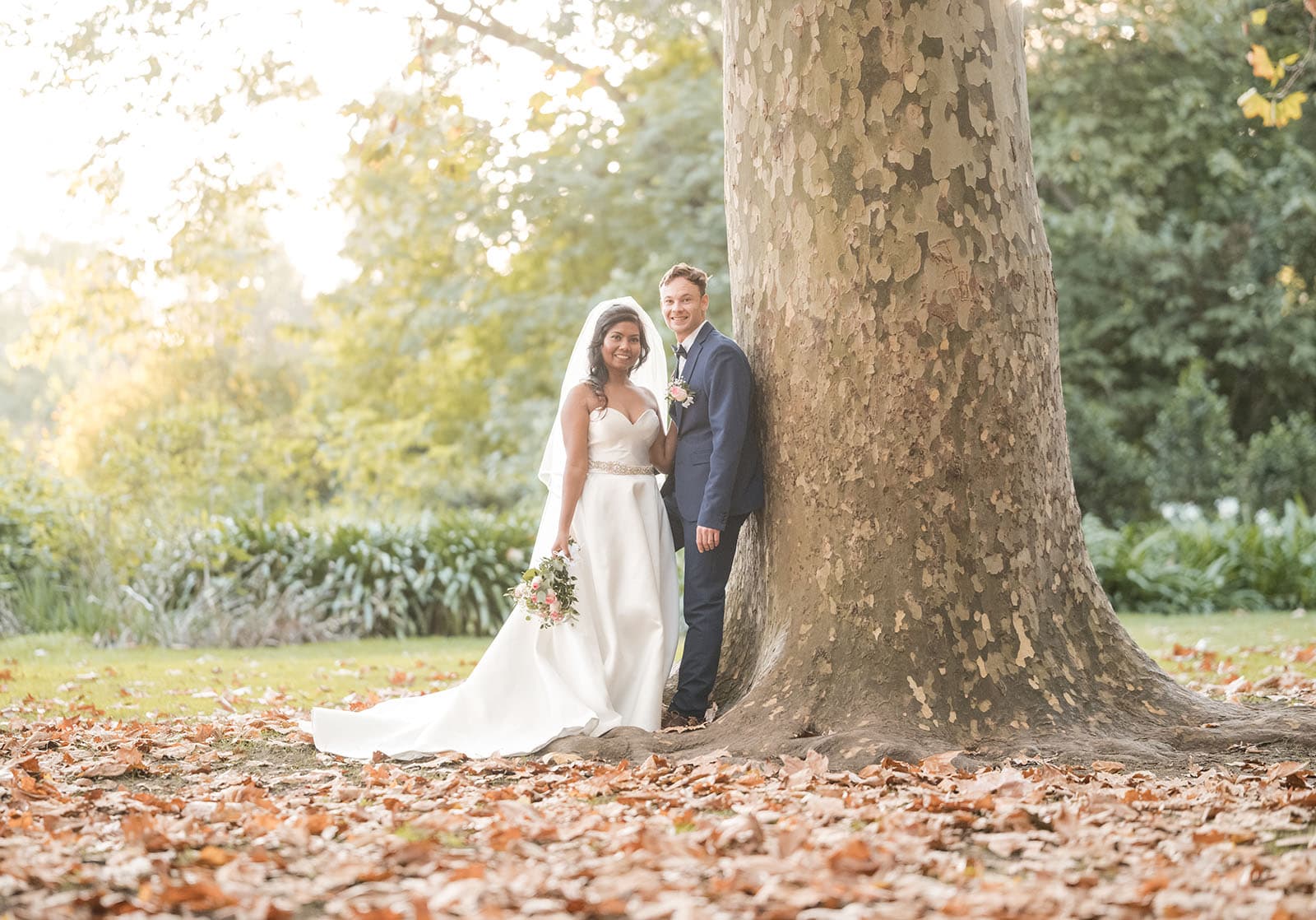 our lady of the rosary church wedding - lorraine & wayne 183 bride and groom leaning on tree