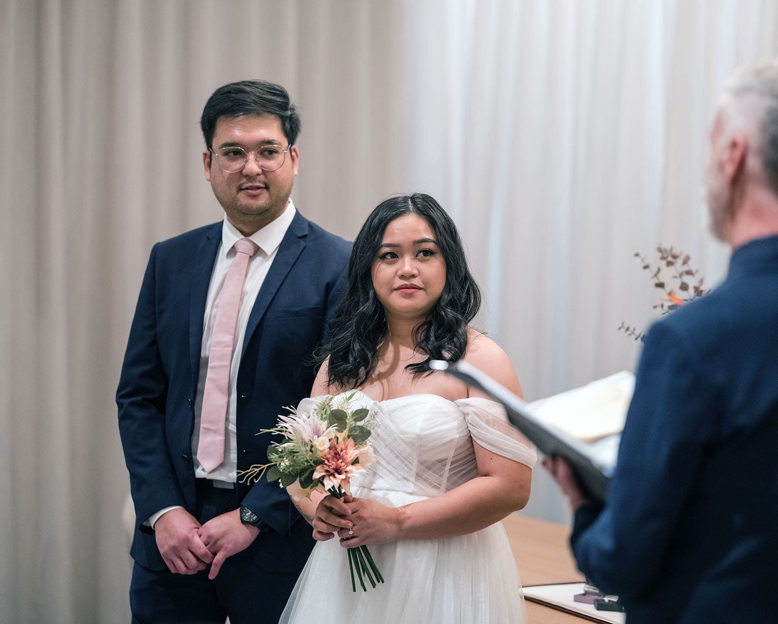 chesser st registration office wedding - khate & angelo 66 Bride and groom looking and listening