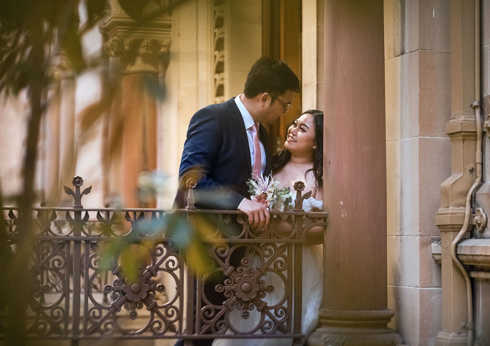 chesser st registration office wedding - khate & angelo 101 Bride and groom on balcony of old building