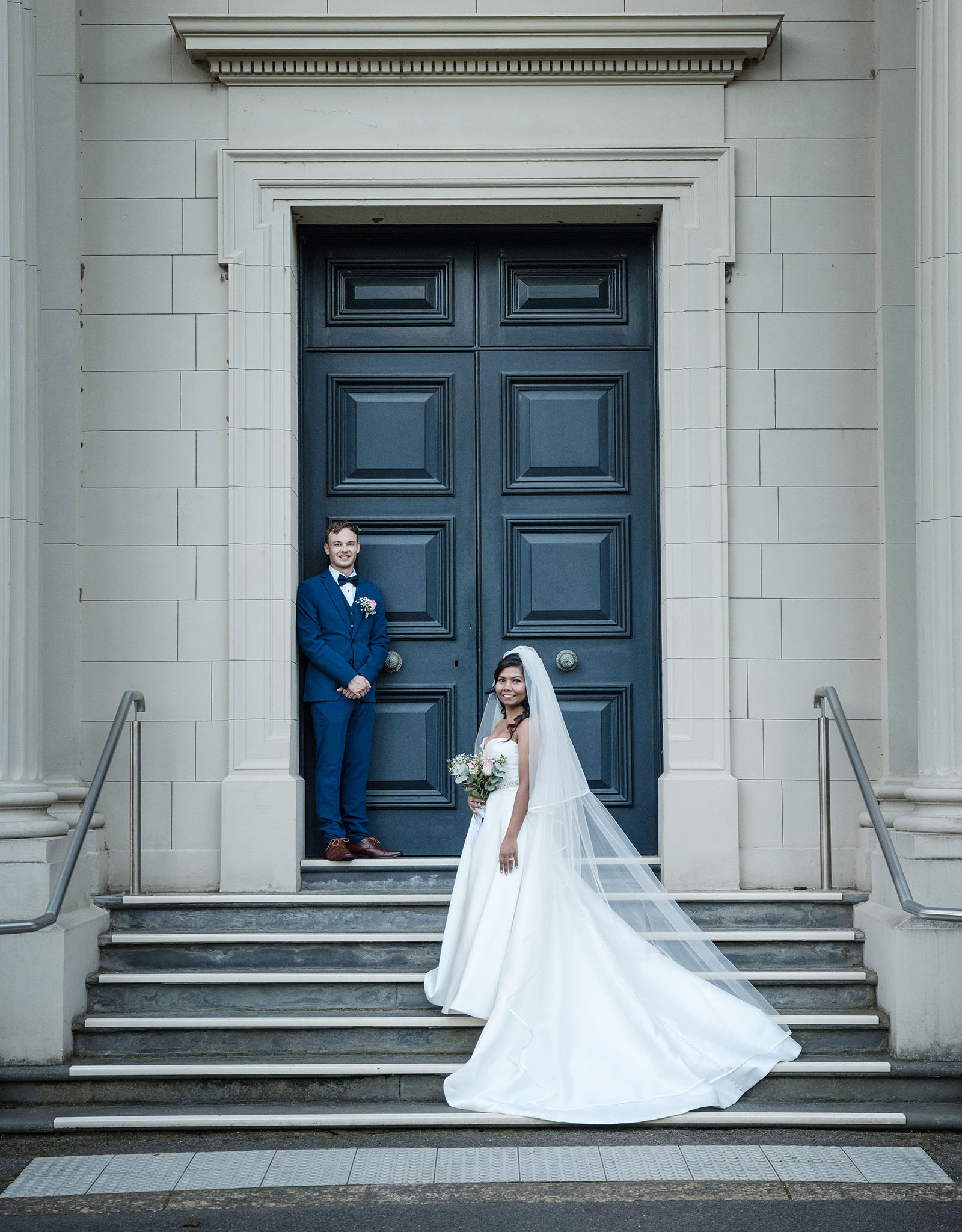 our lady of the rosary church wedding - lorraine & wayne 191 Bride and groom on steps in front of black door