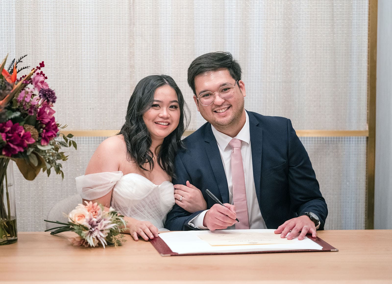 chesser st registration office wedding - khate & angelo 70 Bride and groom signing marriage certificate