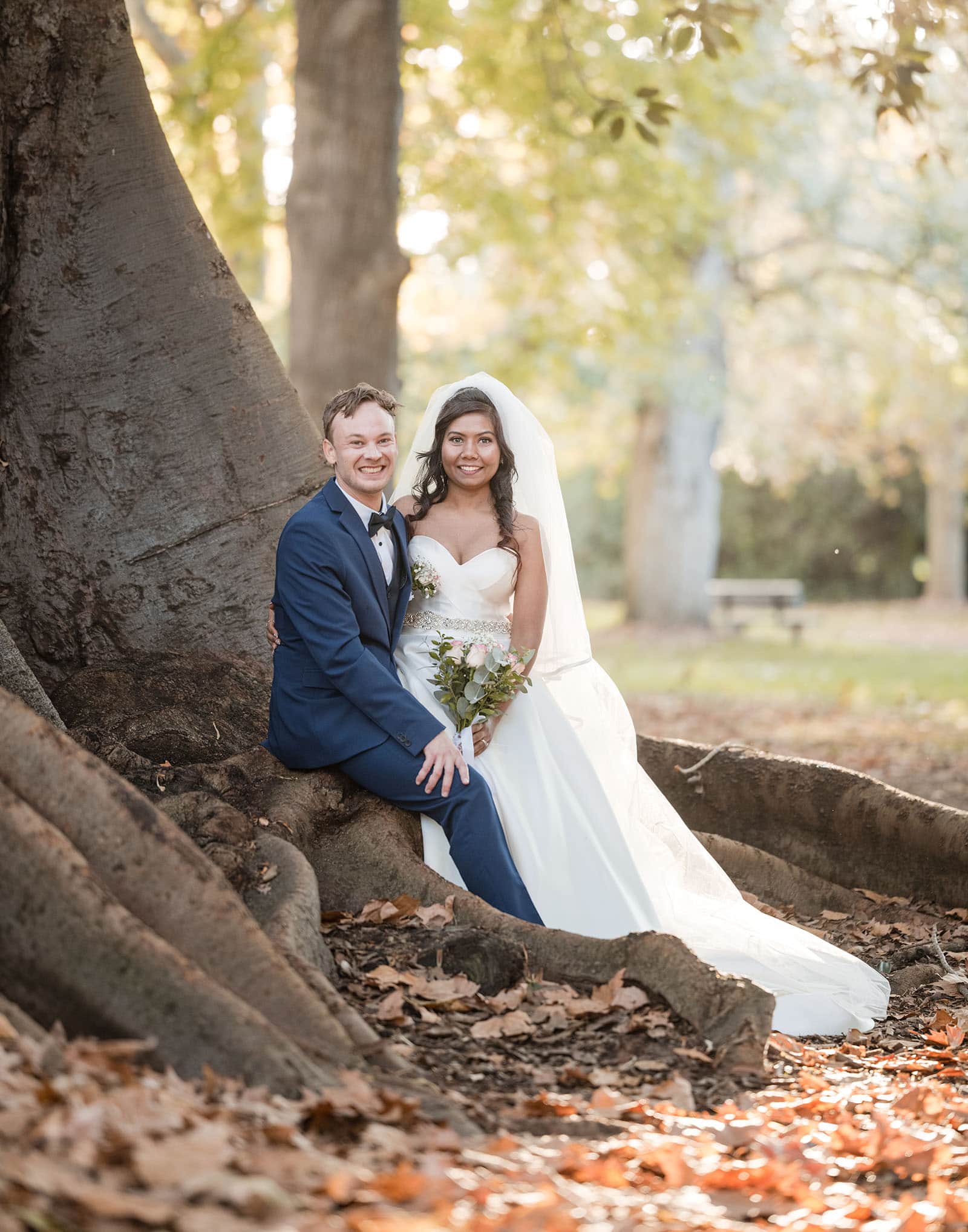our lady of the rosary church wedding - lorraine & wayne 177 Bride and groom sitting together under tree