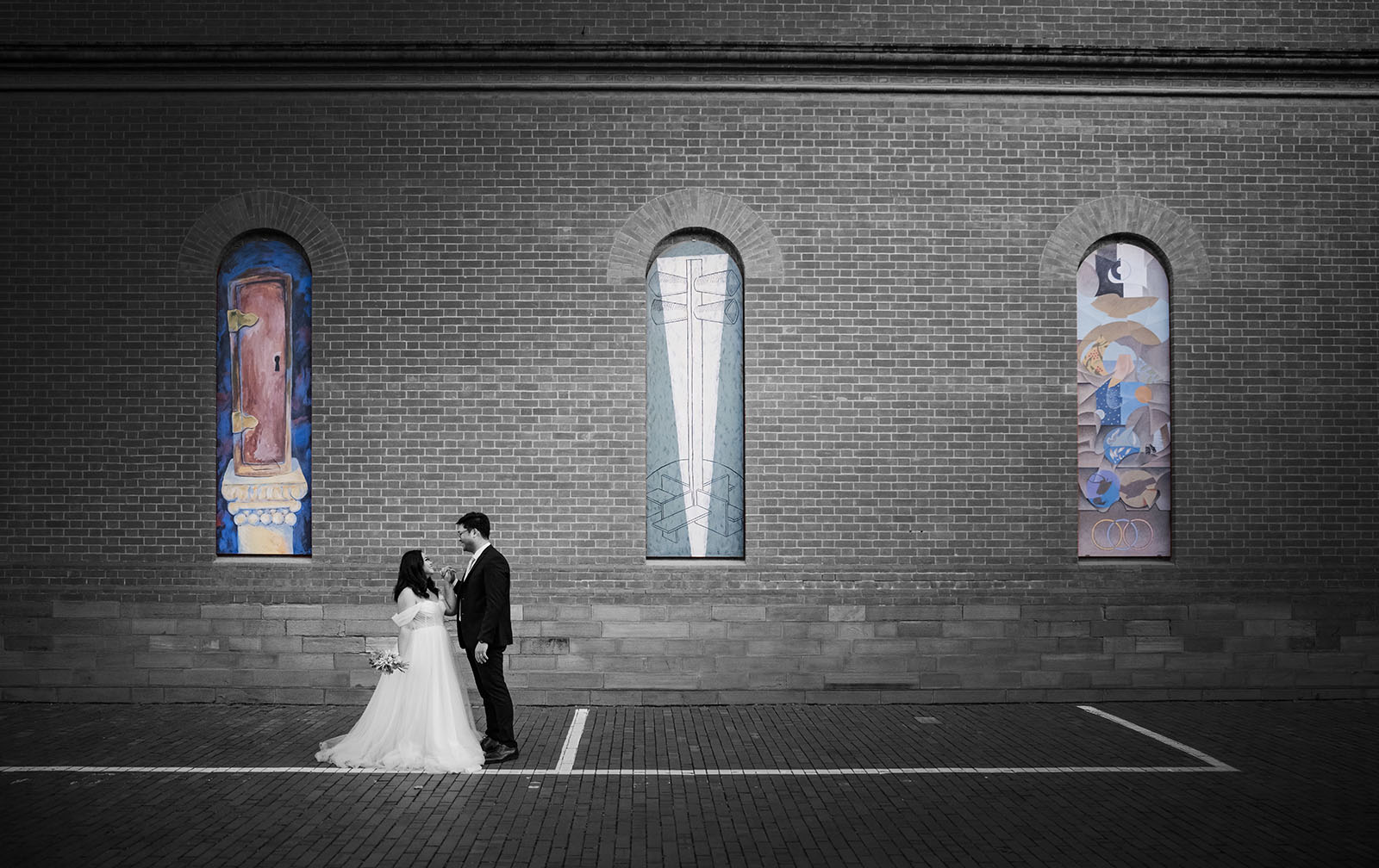 chesser st registration office wedding - khate & angelo 96 Bride and groom standing under art