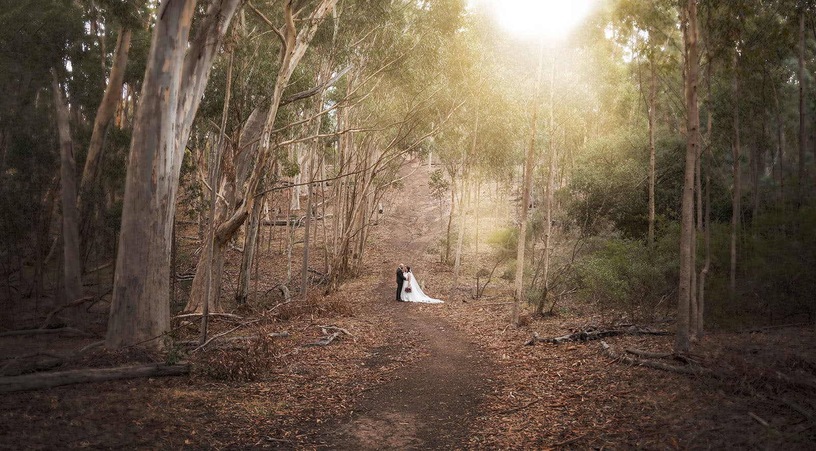 ten22 wedding - julia & daniel 166 Bride and groom under sunlight landscape