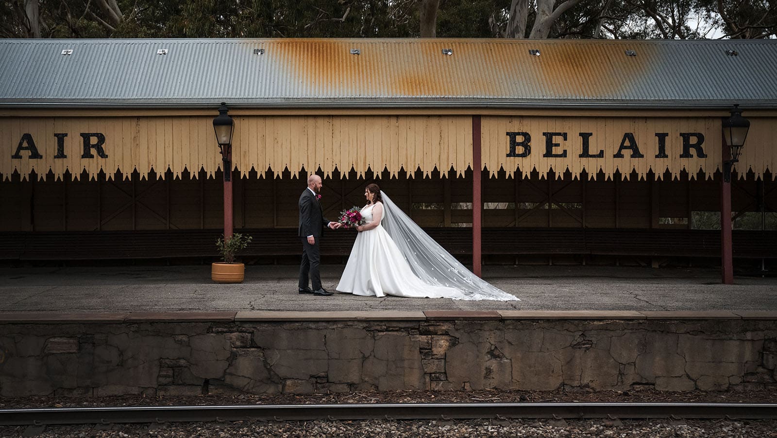 ten22 wedding - julia & daniel 162 Bride and groom walking at Belair Train Station