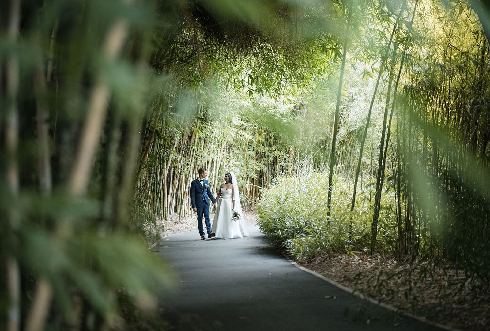 our lady of the rosary church wedding - lorraine & wayne 189 Bride and groom walking in bamboo forest